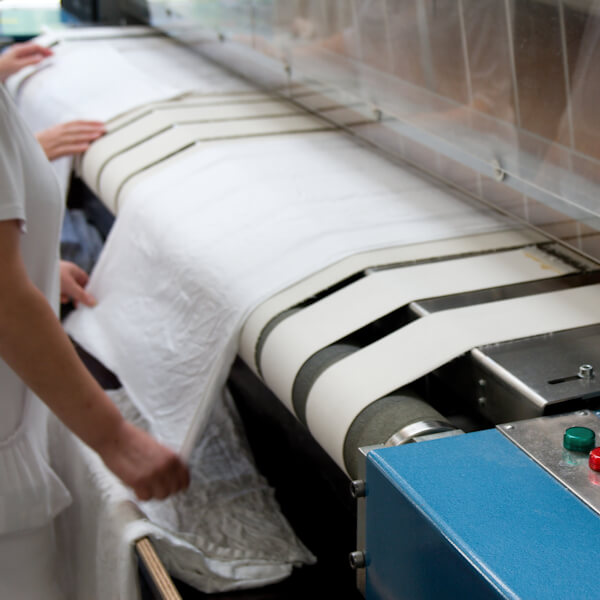 Lady pressing linen